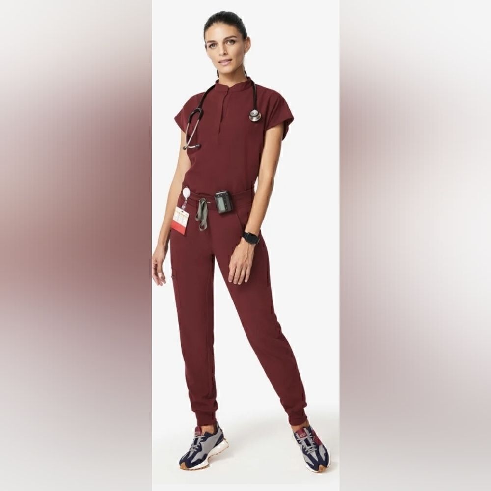 Figs technical collection scrub top in a plum color